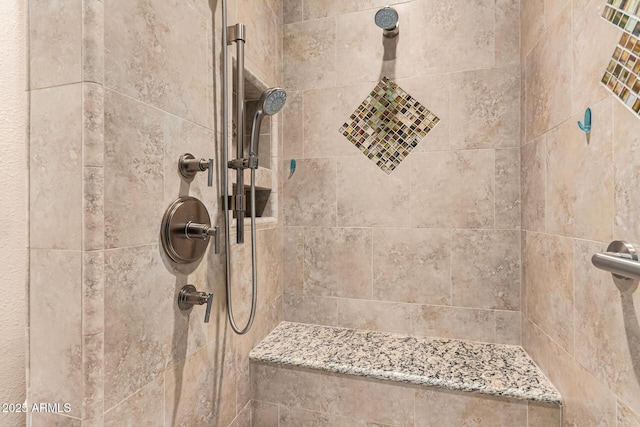 bathroom featuring a tile shower