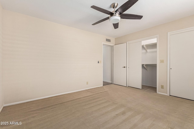 unfurnished bedroom with light carpet and ceiling fan