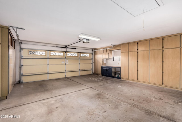 garage featuring a garage door opener