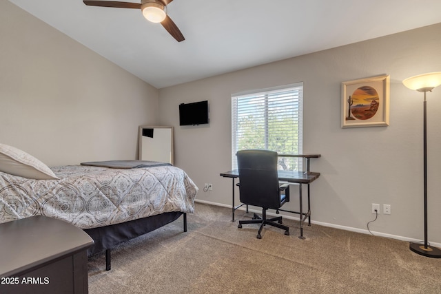 carpeted bedroom with baseboards, a ceiling fan, and vaulted ceiling