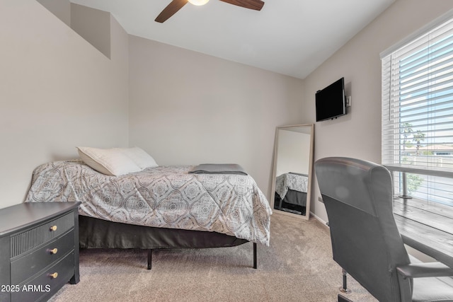 bedroom with carpet flooring, a ceiling fan, and vaulted ceiling