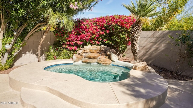 view of swimming pool featuring a fenced backyard and a swimming pool