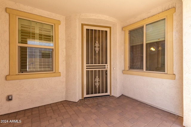 property entrance with a patio