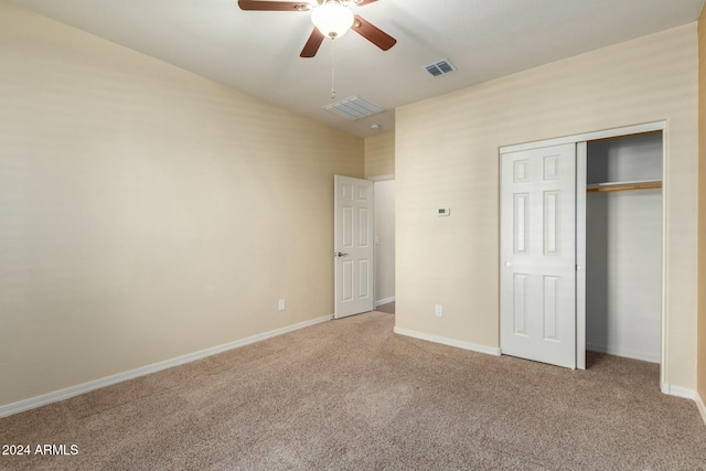 unfurnished bedroom with ceiling fan, a closet, and carpet floors