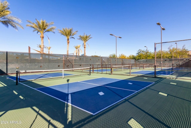 view of sport court featuring basketball hoop