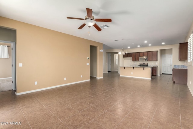 unfurnished living room with light tile patterned floors and ceiling fan with notable chandelier