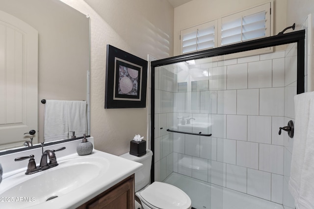 8633 E Kael Cir, Mesa, AZ 85207 - bathroom featuring a stall shower, toilet, and vanity