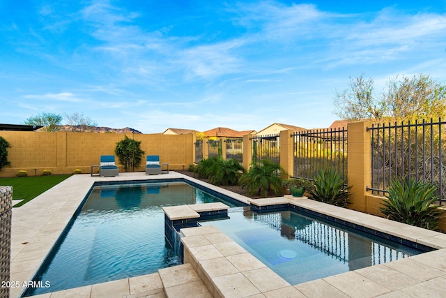8633 E Kael Cir, Mesa, AZ 85207 - view of swimming pool with a pool with connected hot tub and a fenced backyard