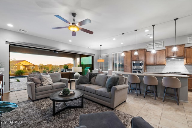 8633 E Kael Cir, Mesa, AZ 85207 - living area featuring recessed lighting, a ceiling fan, and light tile patterned floors