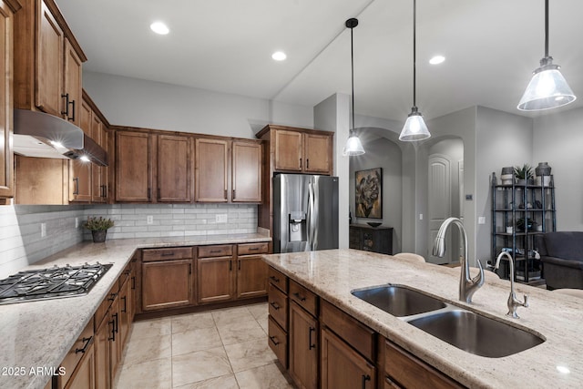 8633 E Kael Cir, Mesa, AZ 85207 - kitchen with appliances with stainless steel finishes, a sink, arched walkways, backsplash, and recessed lighting