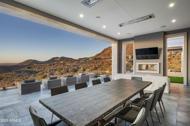 patio terrace at dusk with a mountain view