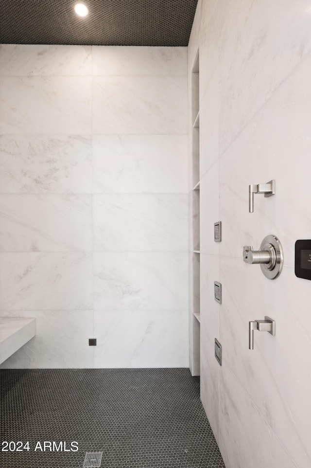 bathroom with a tile shower