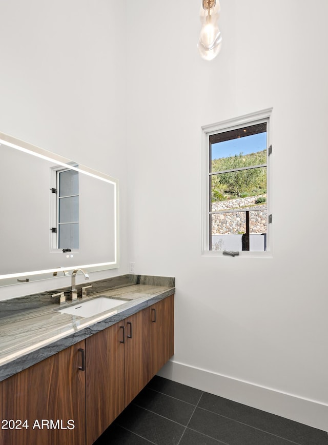 bathroom with vanity and tile patterned floors