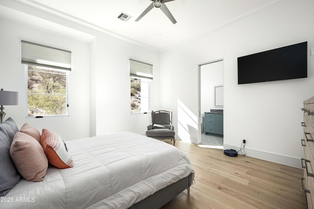 bedroom with ensuite bath, light hardwood / wood-style flooring, ornamental molding, and ceiling fan