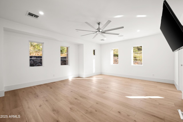 unfurnished living room with ceiling fan and light wood-type flooring