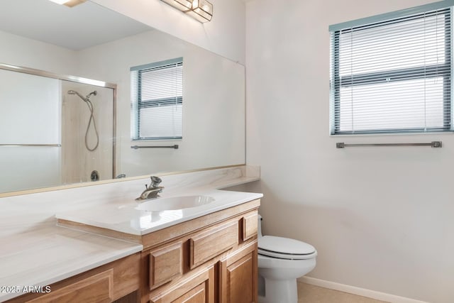 bathroom with a shower with door, toilet, and vanity