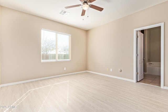 unfurnished room featuring ceiling fan and light wood-type flooring