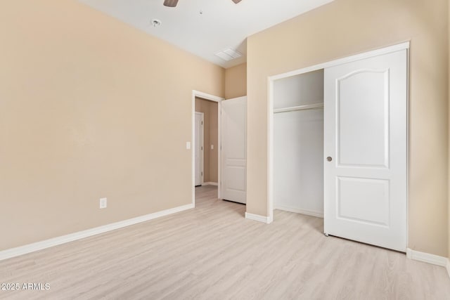 unfurnished bedroom featuring a closet, ceiling fan, and light hardwood / wood-style flooring