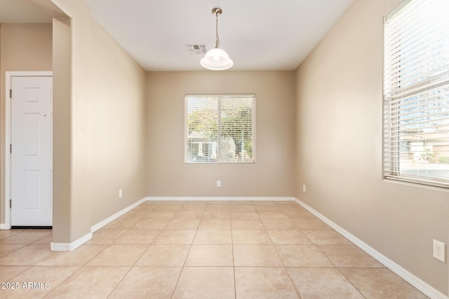 spare room featuring light tile patterned floors