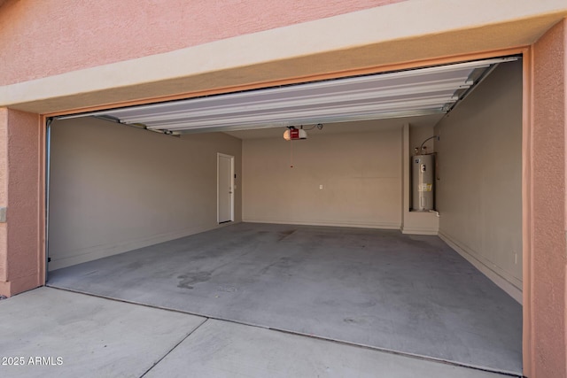 garage with a garage door opener and electric water heater