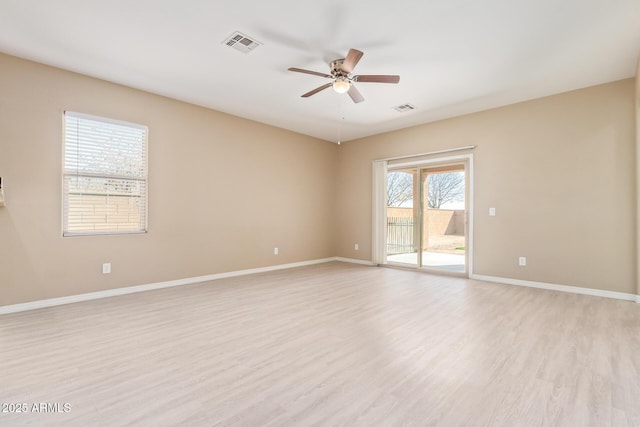 unfurnished room with ceiling fan and light wood-type flooring