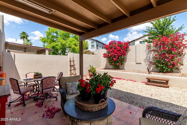 view of patio featuring outdoor dining space and a fenced backyard