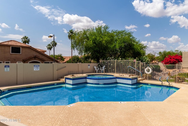 pool with fence and a community hot tub