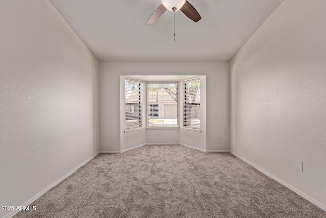 1021 S Greenfield Rd Unit 1211, Mesa, AZ 85206 - carpeted spare room with ceiling fan and baseboards