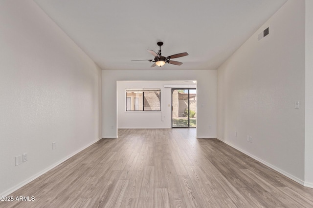 1021 S Greenfield Rd Unit 1211, Mesa, AZ 85206 - unfurnished room featuring a ceiling fan and light wood-style floors