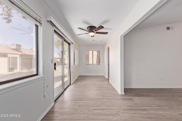 1021 S Greenfield Rd Unit 1211, Mesa, AZ 85206 - unfurnished room featuring a ceiling fan and wood finished floors