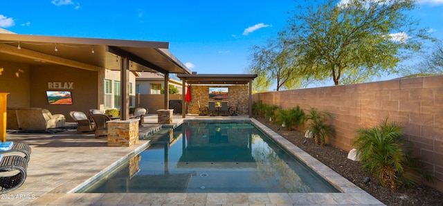 view of pool with a fenced in pool, a patio area, and a fenced backyard