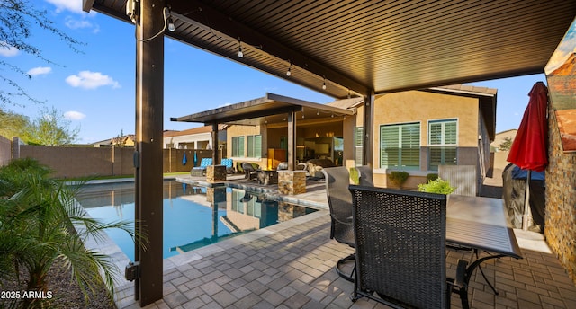 view of swimming pool featuring a fenced in pool, a fenced backyard, and a patio