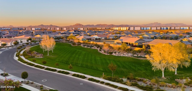 aerial view at dusk with a residential view and a mountain view