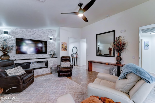 2101 S Meridian Rd Unit 250, Apache Junction, AZ 85120 - living room with ceiling fan, a stone fireplace, and tile patterned floors