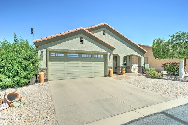 2101 S Meridian Rd Unit 250, Apache Junction, AZ 85120 - view of front of property with an attached garage, concrete driveway, stucco siding, and a tile roof