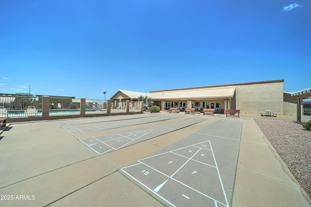 2101 S Meridian Rd Unit 250, Apache Junction, AZ 85120 - surrounding community with shuffleboard, a swimming pool, and fence