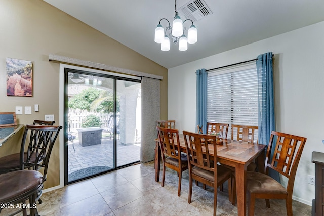 2101 S Meridian Rd Unit 250, Apache Junction, AZ 85120 - dining area with lofted ceiling, a chandelier, tile patterned floors, and baseboards