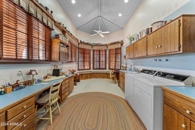 kitchen featuring washing machine and clothes dryer, ceiling fan, vaulted ceiling, decorative light fixtures, and sink