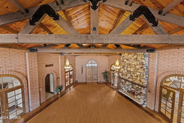 hall featuring wood ceiling, beam ceiling, and high vaulted ceiling