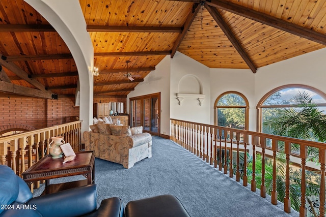 interior space featuring wooden ceiling, carpet flooring, high vaulted ceiling, and beam ceiling