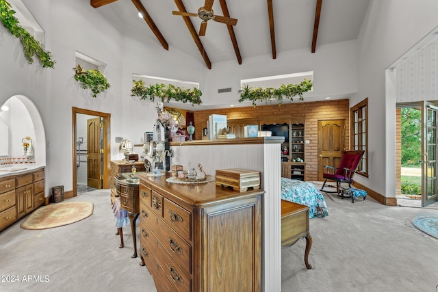 interior space featuring beam ceiling and high vaulted ceiling