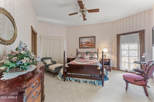 bedroom featuring light colored carpet and ceiling fan