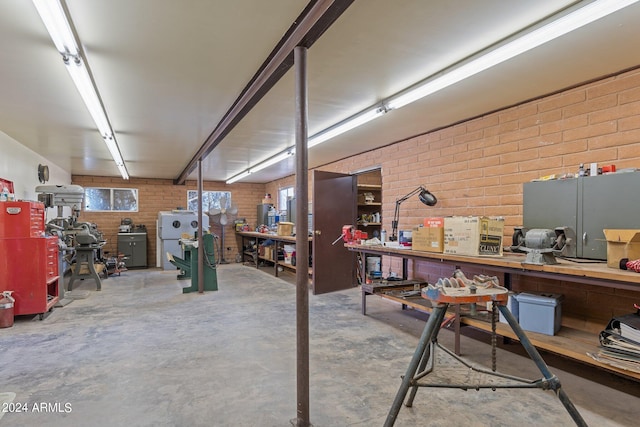 interior space featuring a workshop area and fridge