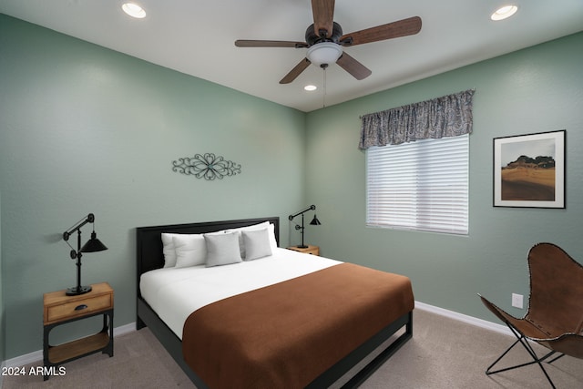 carpeted bedroom featuring ceiling fan