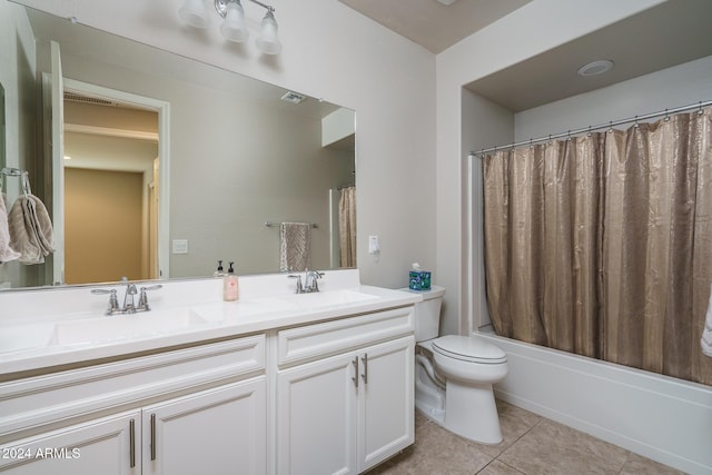 full bathroom with tile patterned flooring, vanity, toilet, and shower / bathtub combination with curtain