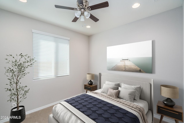 bedroom with ceiling fan and carpet floors