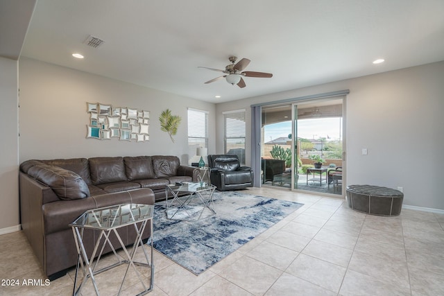 tiled living room with ceiling fan