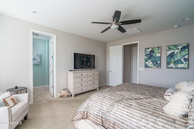 bedroom featuring ceiling fan and light colored carpet