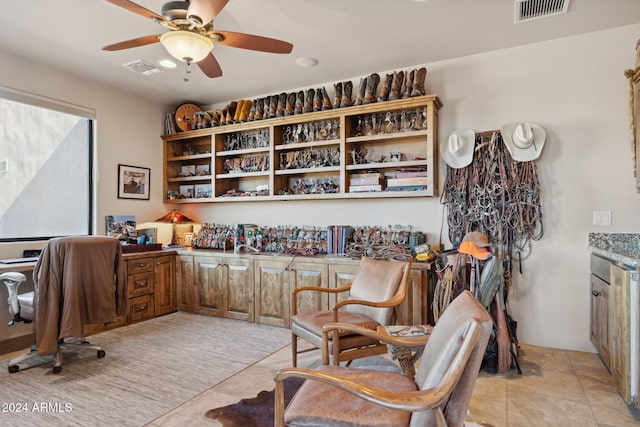 home office with ceiling fan and light tile patterned floors