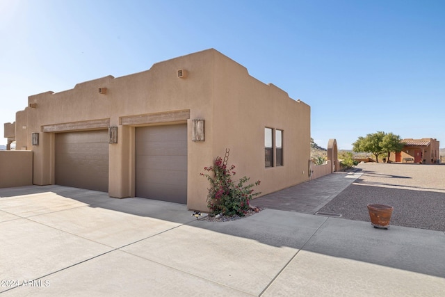 view of property exterior with a garage